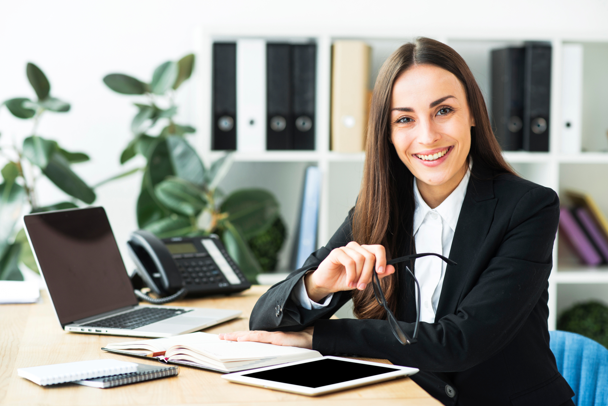 Woman in smart work attire smiling at camera